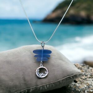 Sea glass and mermaid silver plated pendant. 
Artisan made.